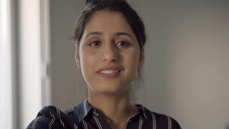Face-of-positive-Latin-girl-enjoying-friendly-video-talk